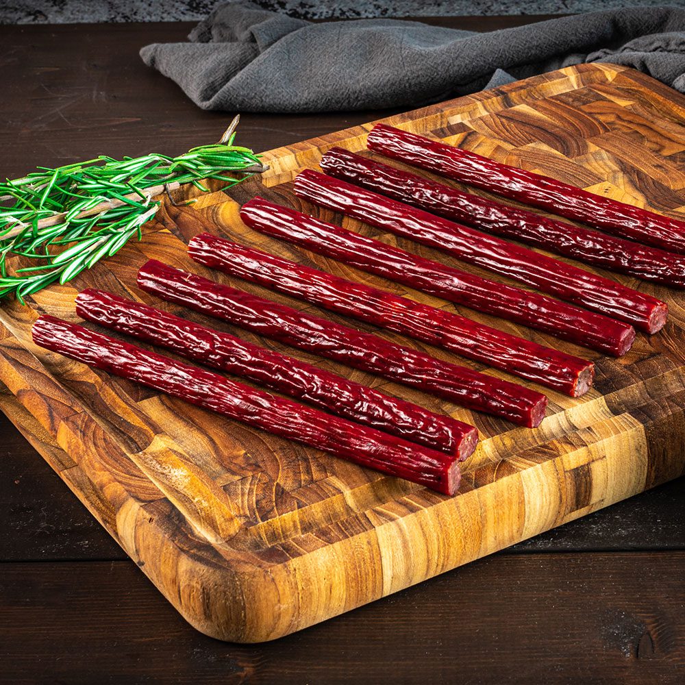 beef sticks on cutting board